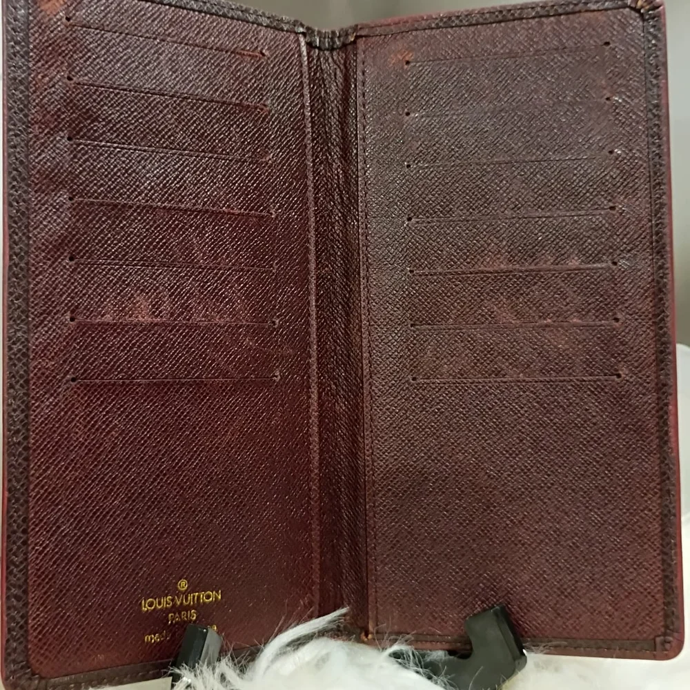 Louis Vuitton Taiga leather long wallet.